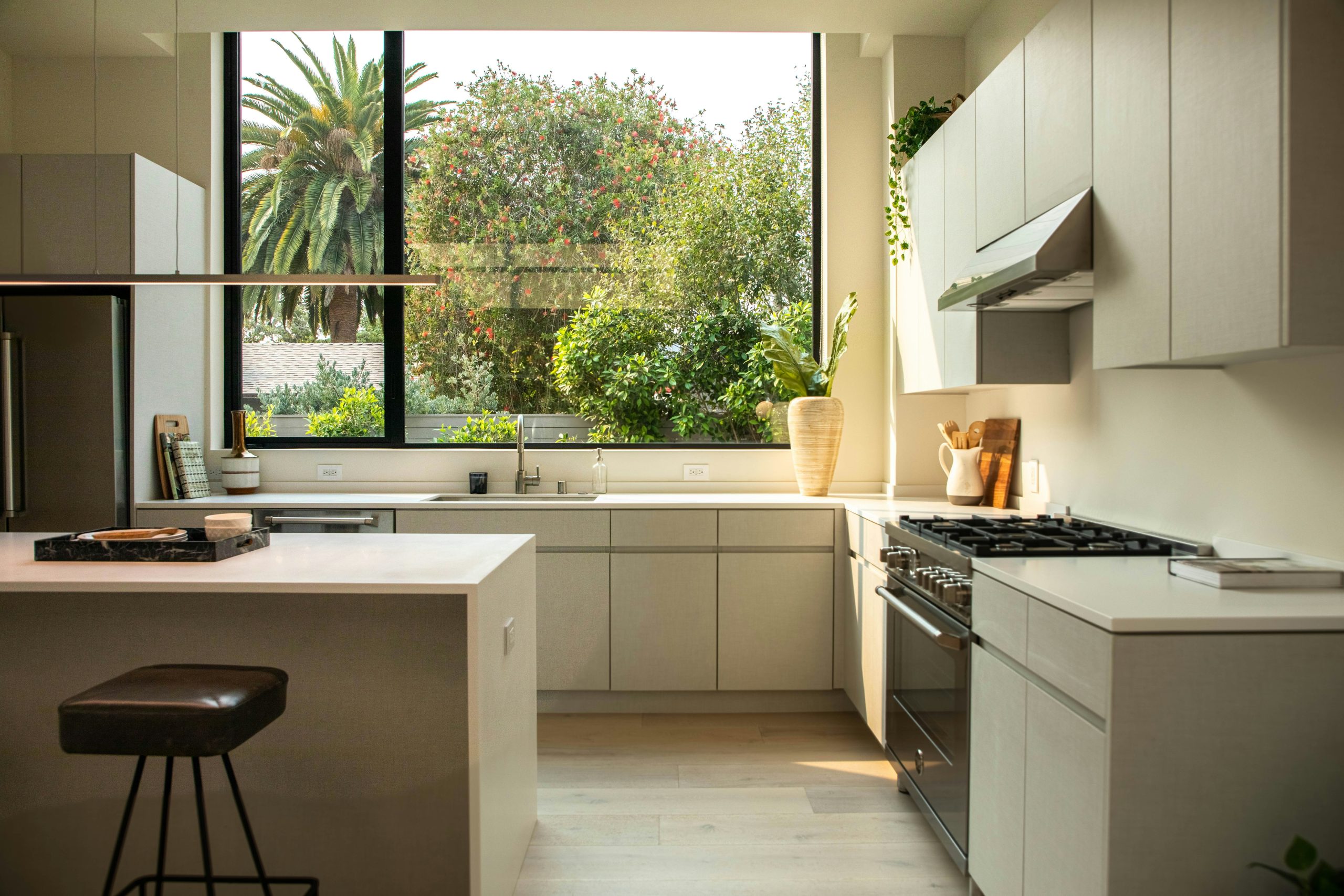 image of a kitchen designed in a modern style with a big window.