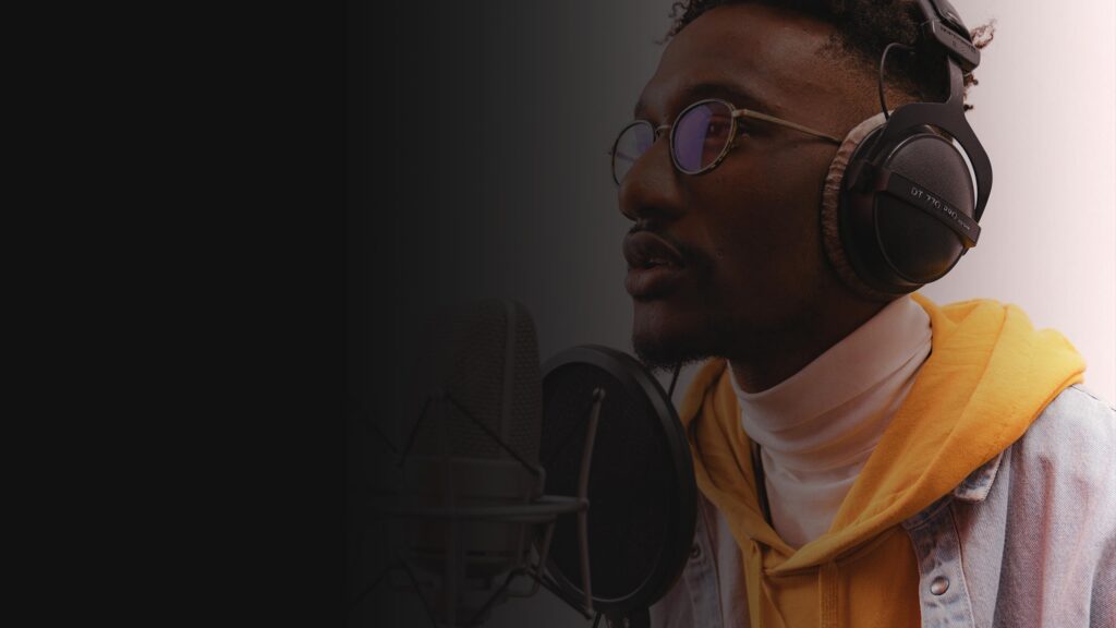 Voice artist recording a radio advert in a studio