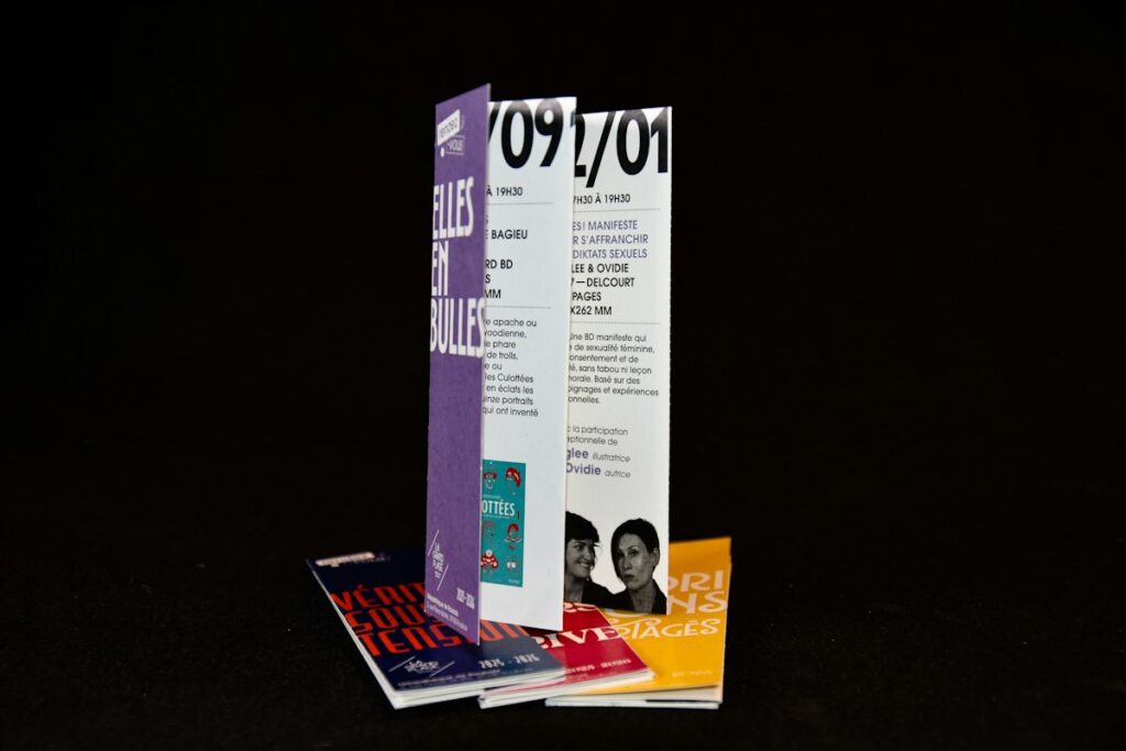 Stack of printed folded brochures and leaflets