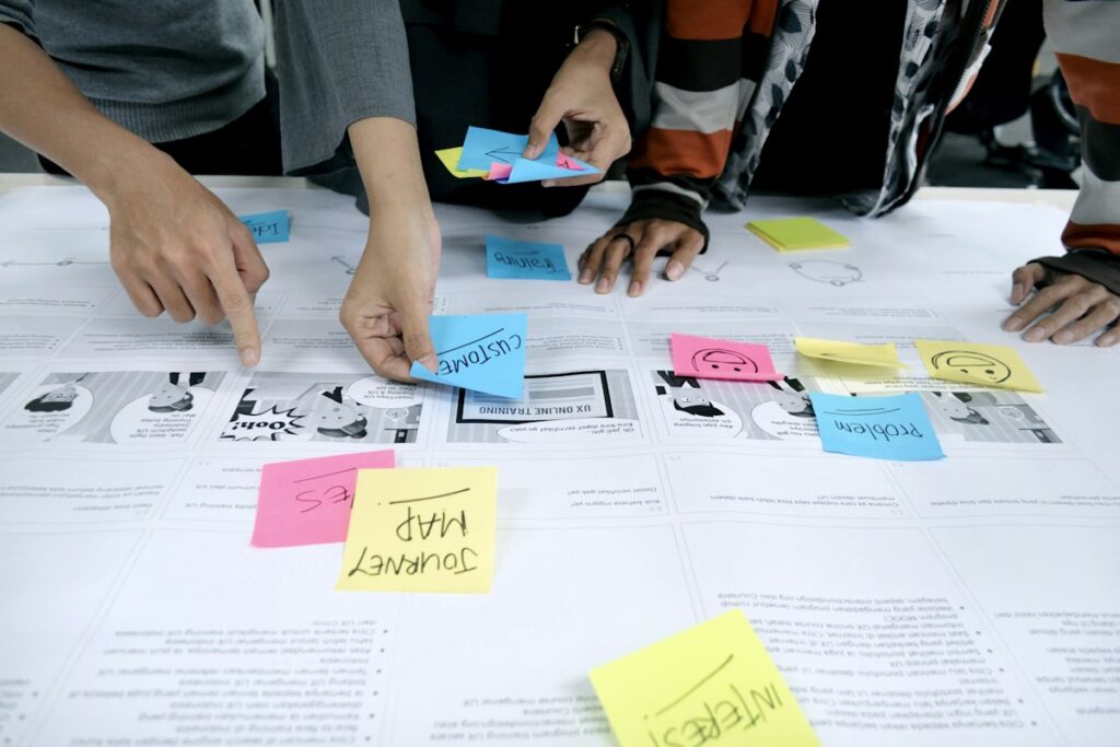 Small team brainstorming ideas with sticky notes