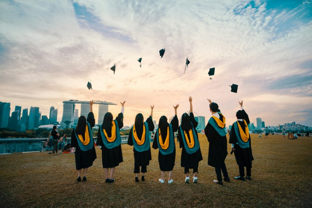 University graduates throwing their caps in the air