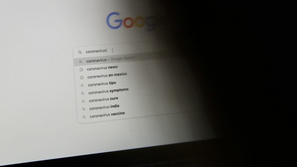 Laptop displaying a Google search page for paid search advertising