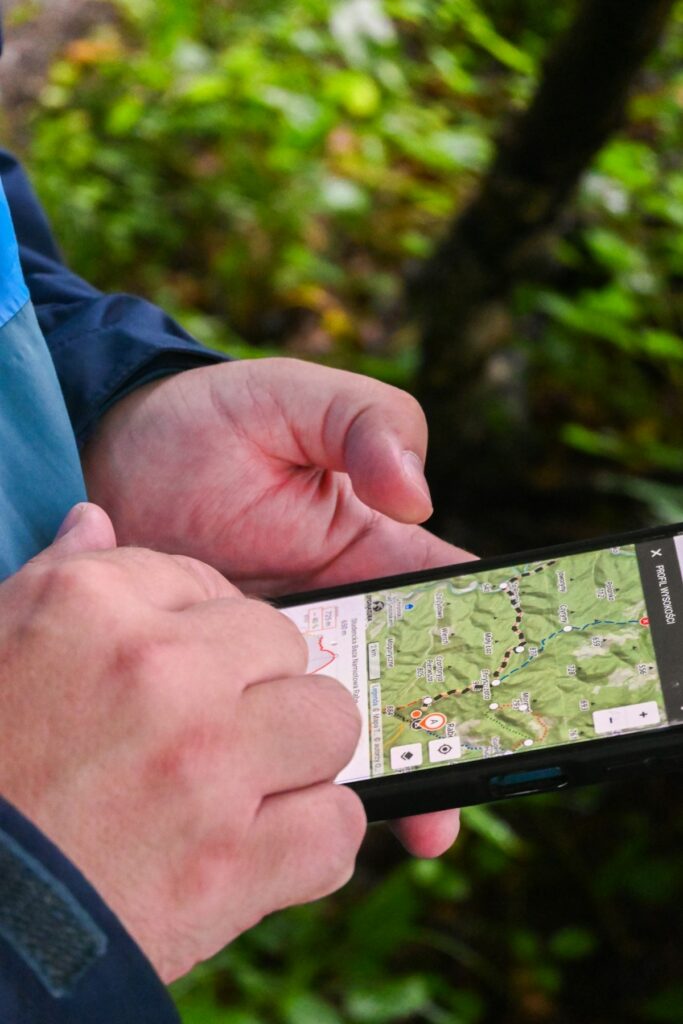 Hands holding a smartphone displaying a local map