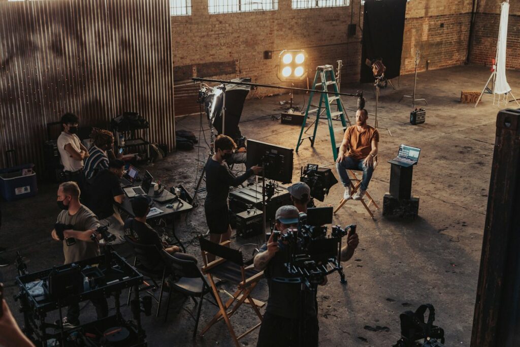 Film crew gathered around a camera setup during a shoot