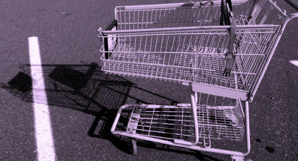 An empty shopping trolley in an empty parking space